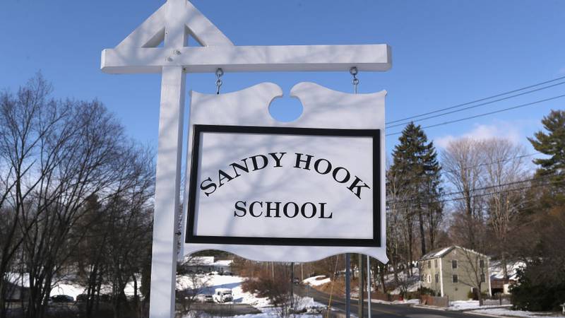 SANDY HOOK, CT - MARCH 14:  A sign stands near the site of the December 2012 Sandy Hook school shooting on the day of the National School Walkout on March 14, 2018 in Sandy Hook Connecticut. Several hundred students at the school, near the site of the Sandy Hook school massacre of December 14, 2012, staged a protest one month after 17 people were killed at Stoneman Douglas High School in Parkland, Florida. Media and visitors were not allowed on the Newtown High campus for the event.  (Photo by John Moore/Getty Images)