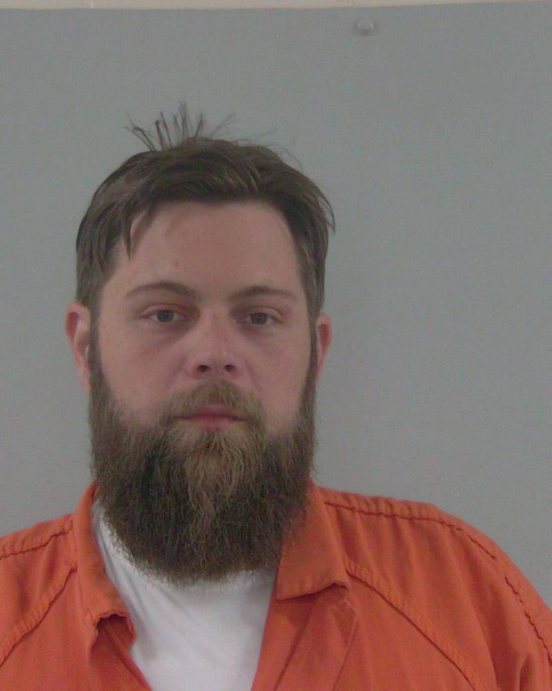 Matthew Gooch of Lake City was arrested and charged with shooting into an occupied home.