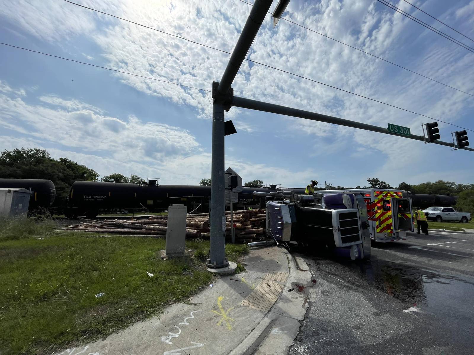Crash between train and log truck backs up traffic on U.S. 301 in