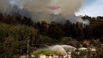 A fast-moving brush fire in California burned 2 homes while others were damaged by smoke and water