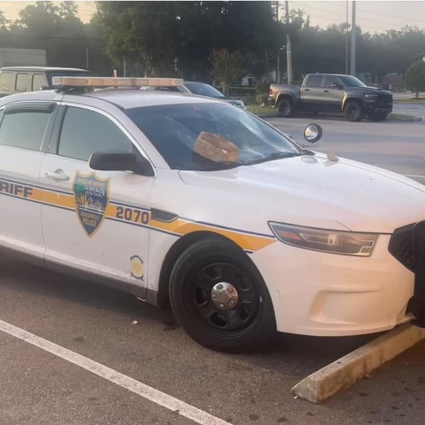 JSO cruiser windshield smashed with concrete brick