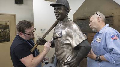 A rebuilt bronze Jackie Robinson statue returns to Kansas 6 months after the original was stolen