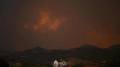 Giant plumes of smoke dot Southern California skies as crews fight several major wildfires