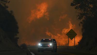 Wildfire east of LA threatens thousands of homes and forces evacuations